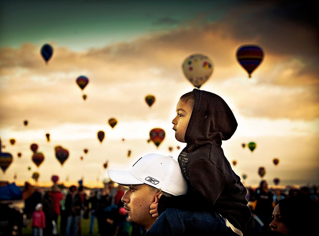 Albuquerque Balloon fiesta with the family. Father and son surrounded by hot air balloons
