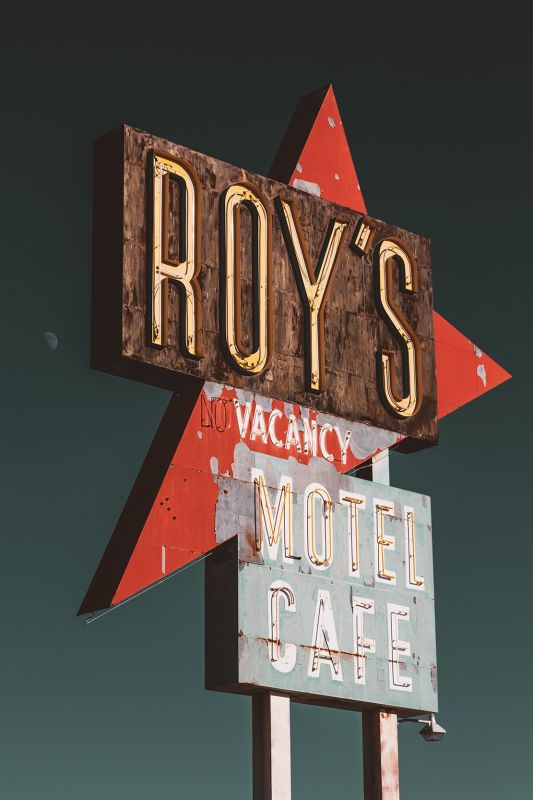 The vintage, peeling neon sign for Roy
