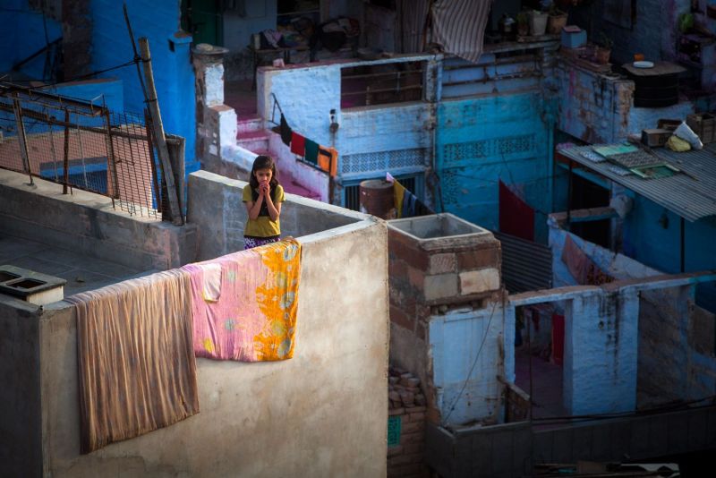 The Blue City, Jodhpur, girl praying on the building terrace