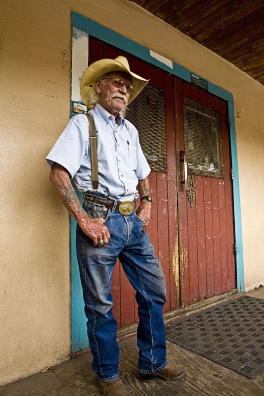 Portrait of an old cowboy outside an old bar, Madrid, New Mexico